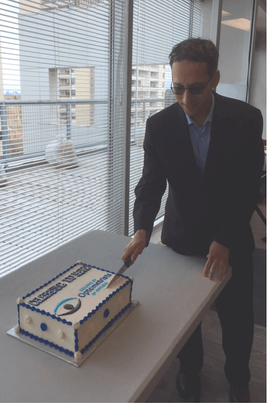 College of Optometrist of Ontario President Dr. P. Hemami cuts cake celebrating 100 years of regulation April 24, 2019