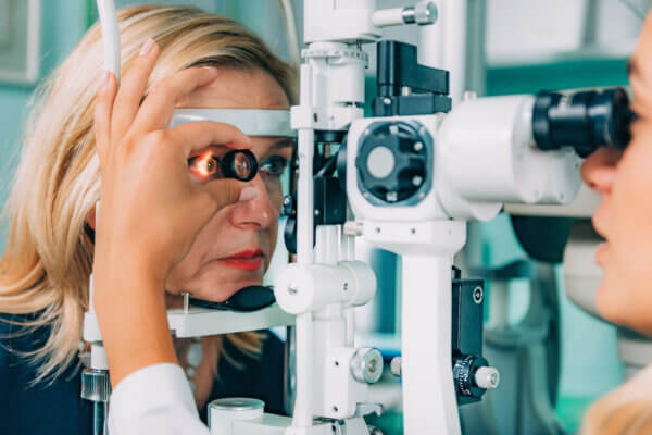  An optometrist using a Slit Lamp.